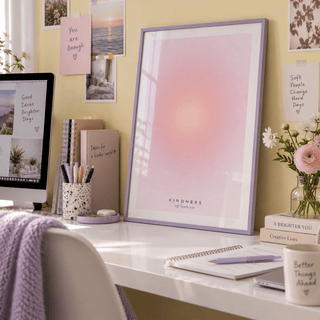 Blush pink aura print above a desk in a teen creative