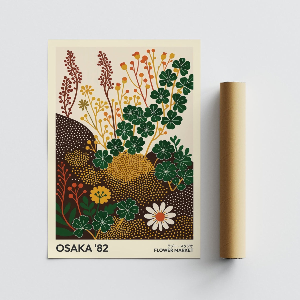 Wildflower art prints with clover and other plants in green, yellow and brown tones next to a packaging tube