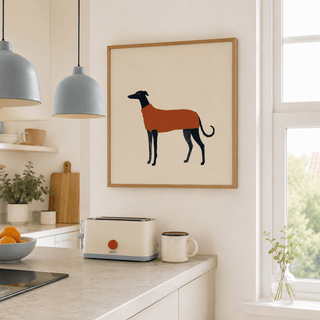 Greyhound art print of a dog in a brown sweater hanging in a light kitchen above a toaster