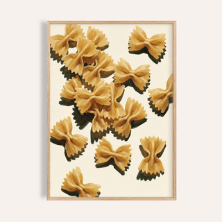Farfalle pasta art in beige and brown tones with a light wood frame