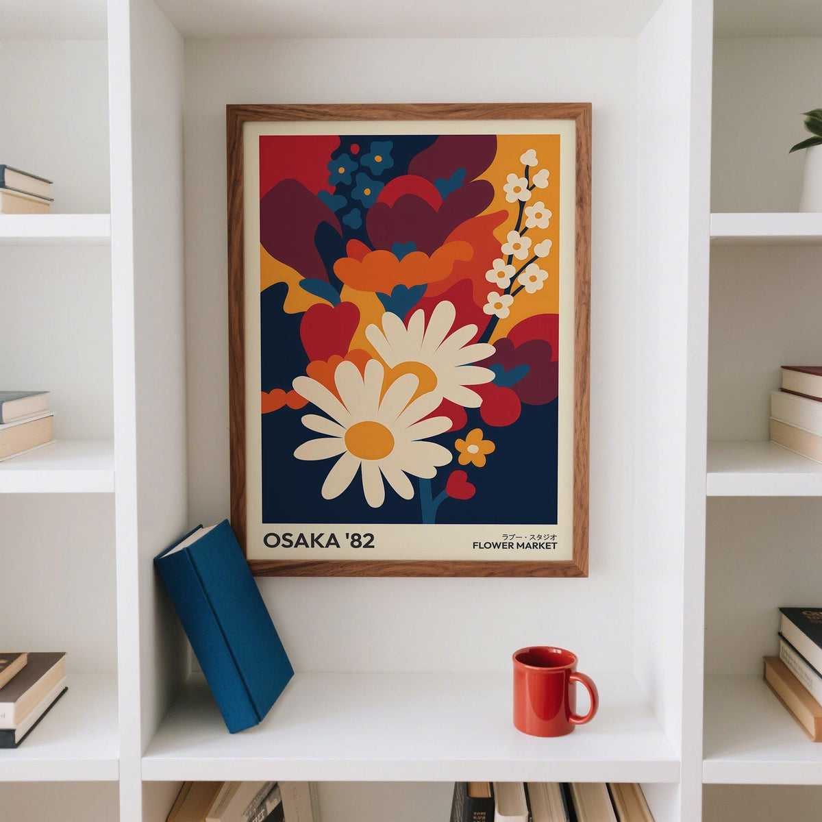 Framed Art Flower Print of white daisies and colourful flowers with a red mug below