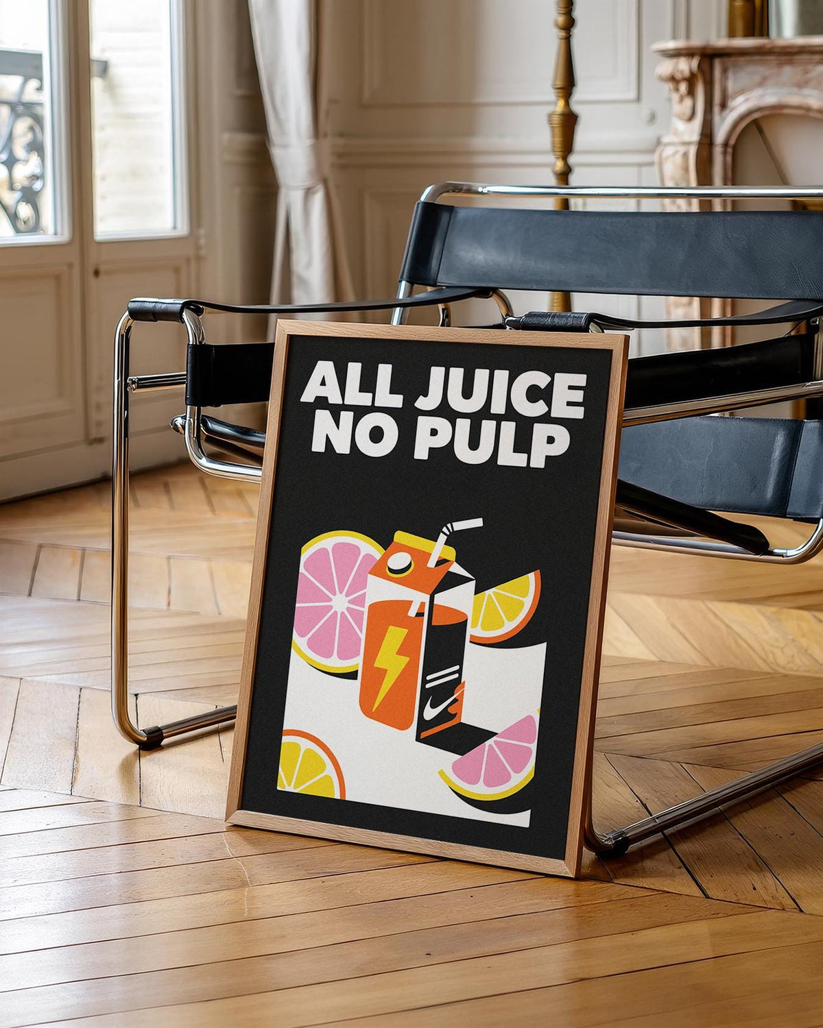 Framed Pop Art Poster of an orange juice carton with citrus fruits leaning on a black chair