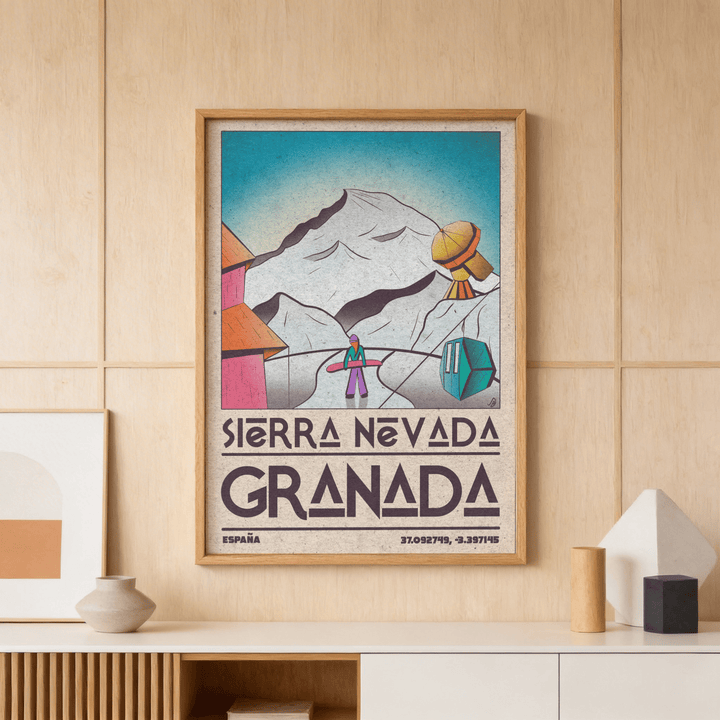 Sierra Nevada art print framed on a wood panel wall above a shelf with geometric vases
