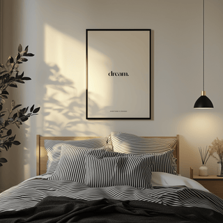Personalised Quote Poster framed print above bed with striped pillows and a small plant nearby