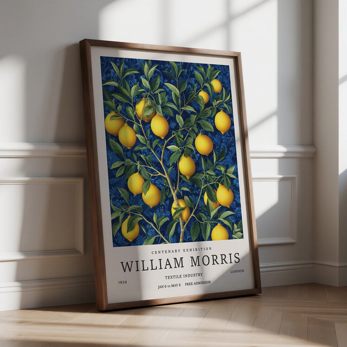 Print leaning on floor of lemon wall art with yellow fruit and green leaves on blue background