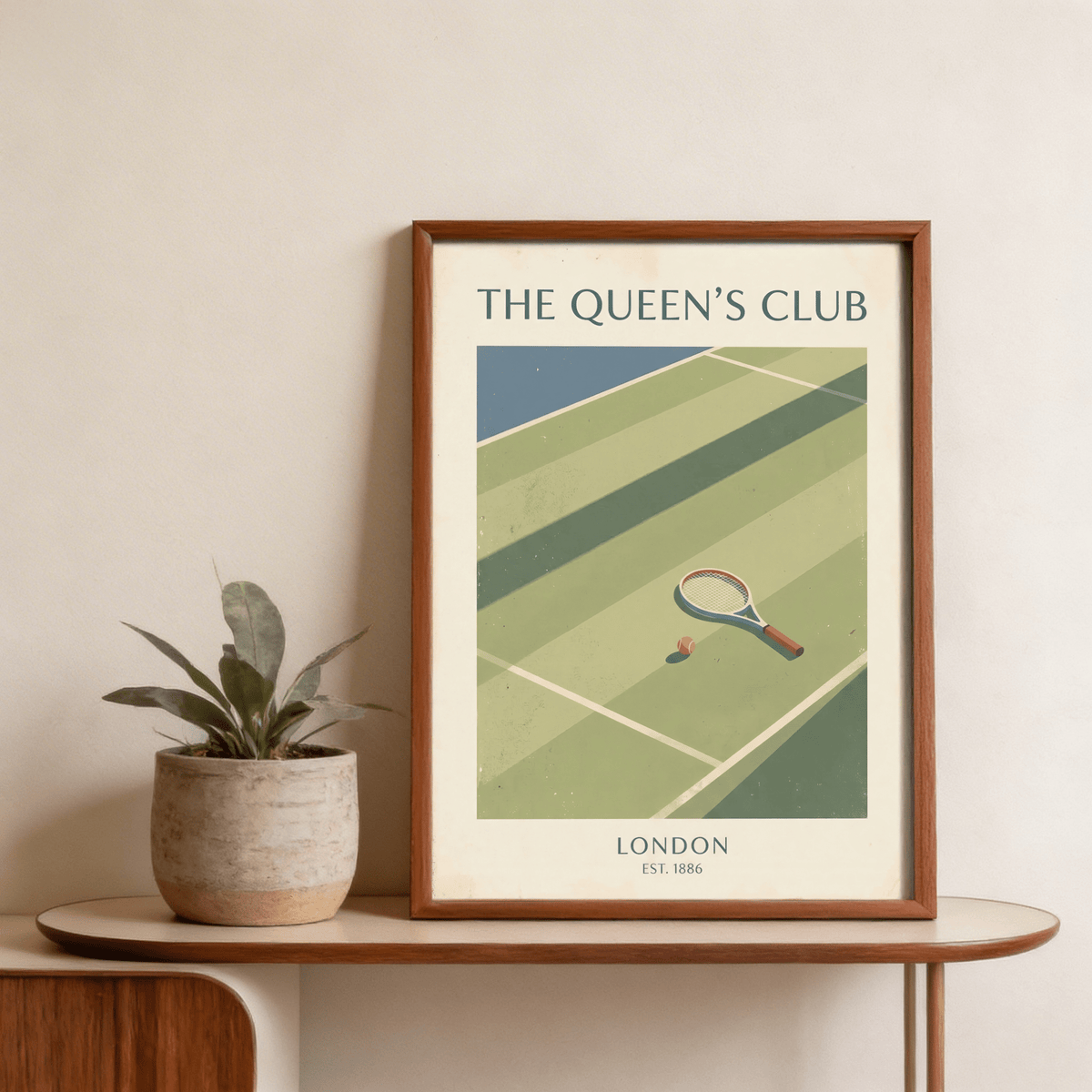 Framed Tennis Wall Art showing tennis racket and ball on court with a plant on table