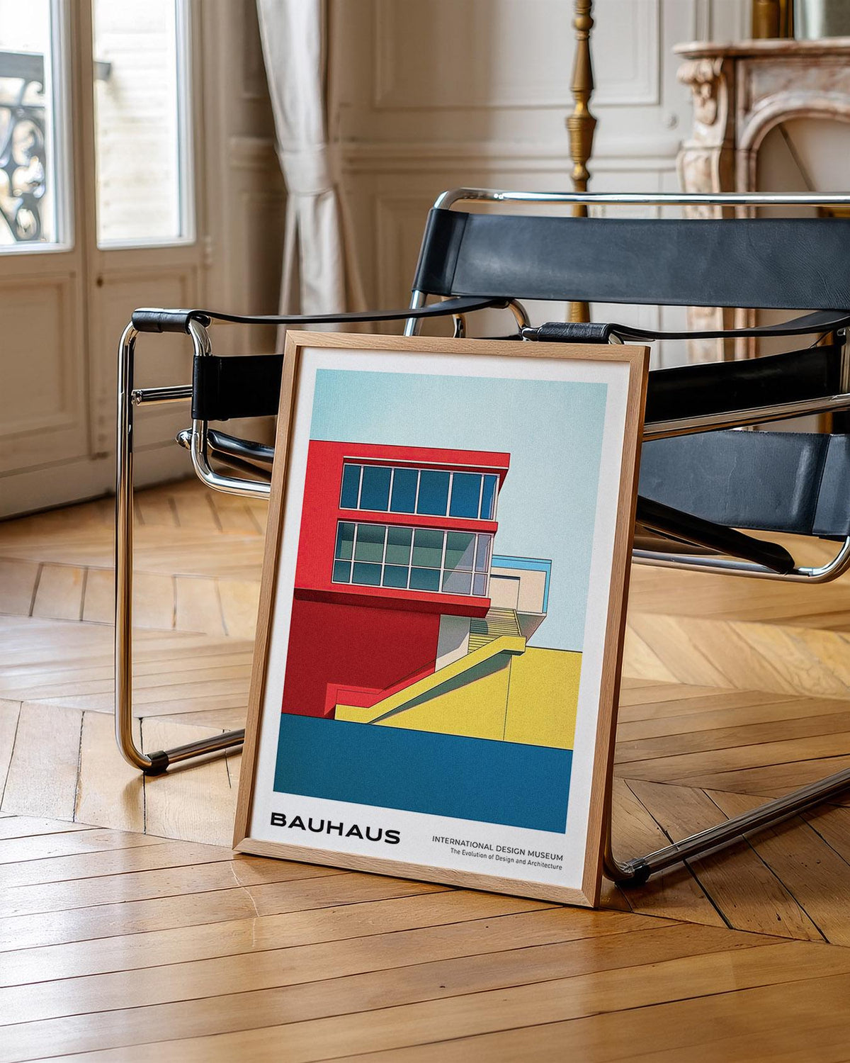 Mid Century Modern Art Prints framed print of a bauhaus building in red, yellow and blue leaning on a black chair