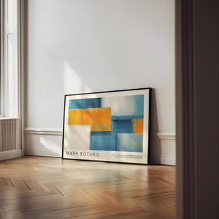 Wide Wall Art leaning on floor with abstract geometric blocks in blue and orange by a window