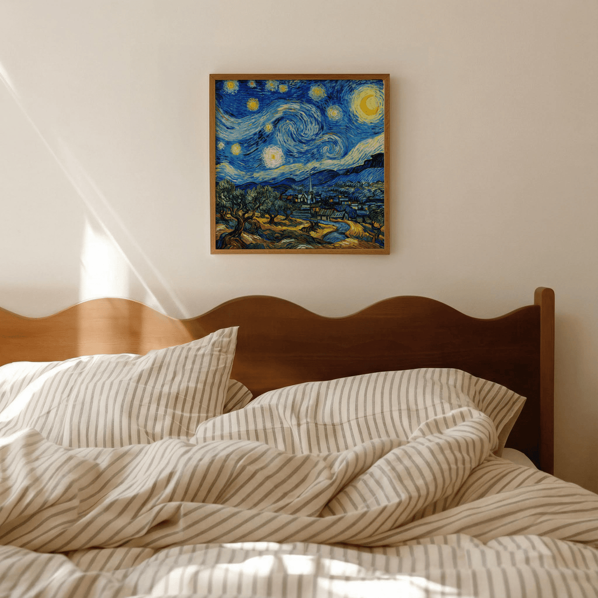 Starry Night Art Print above a wooden bed showing a vibrant abstract night sky in blue and yellow
