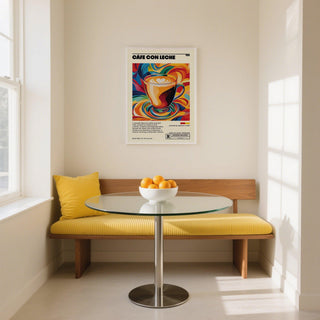 Print on a wall in a dining room featuring a colourful pop-art cup of cafe con leche above a yellow cushioned bench