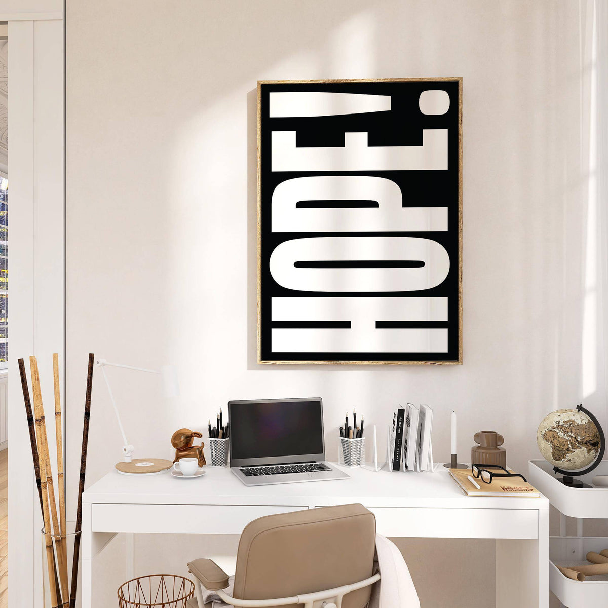 Inspirational Artwork with HOPE! in bold white letters on black above a white desk with office supplies