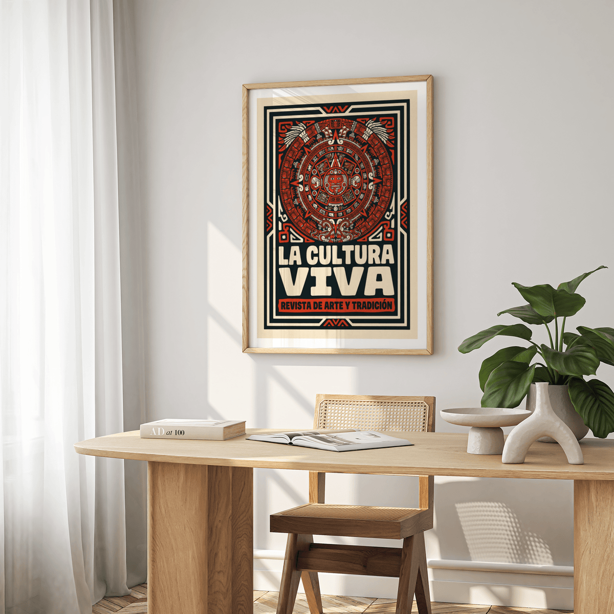 Aztec culture art print with red and black folk-art design on a dining room wall with wooden table