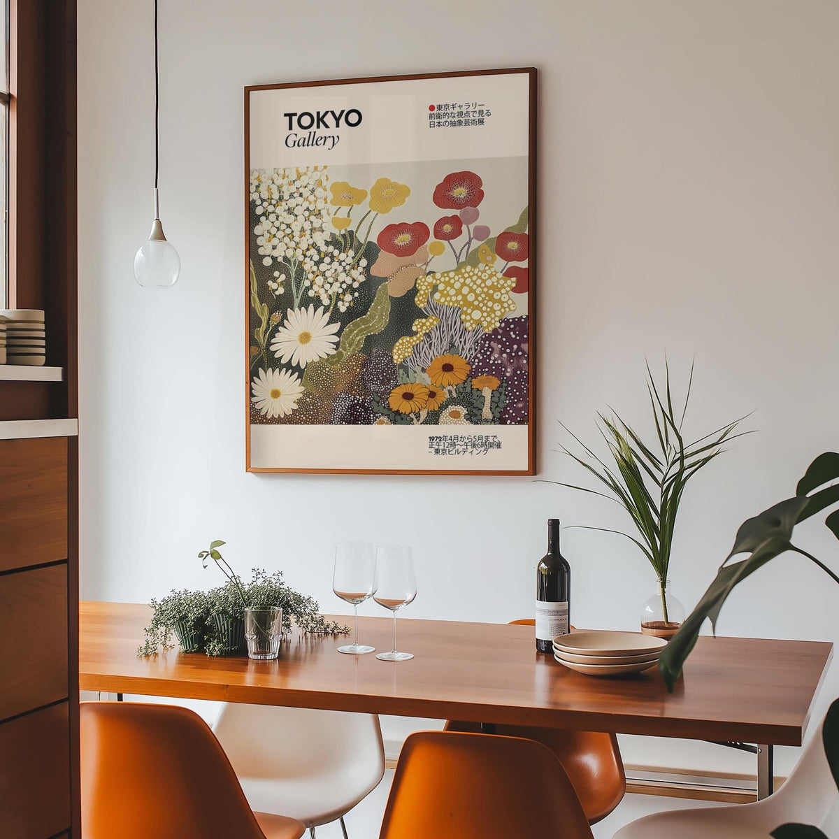 Wildflower wall art of golden and red stylized flowers in a dining room with plants and glasses