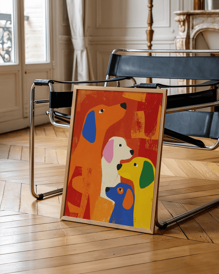 Print leaning on a chair of colourful abstract dogs in orange, yellow and blue on a wooden floor