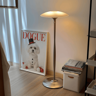 Christmas Shih Tzu Poster print leaning on the floor with a lamp and stack of magazines nearby