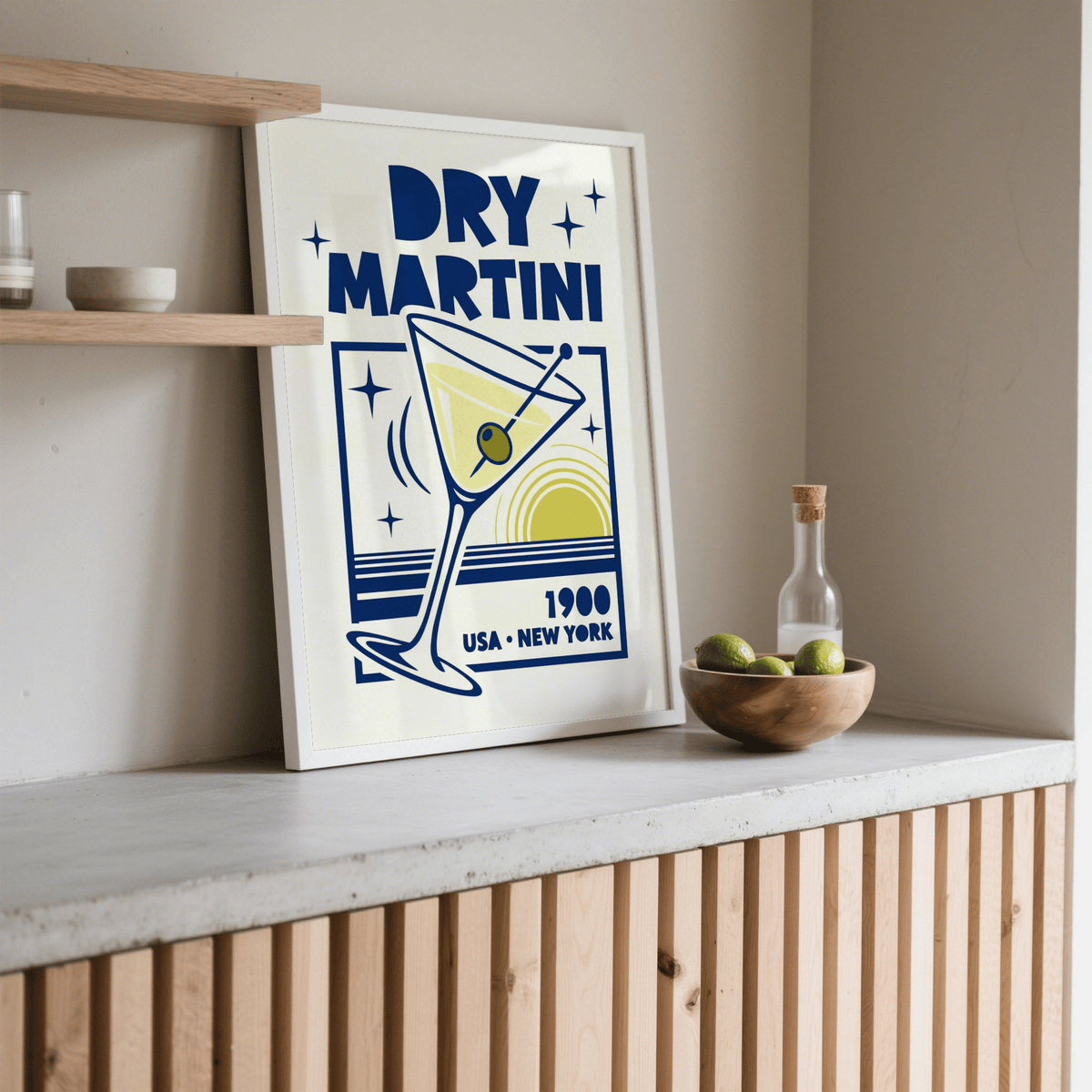 Print leaning on a shelf Dry Martini Poster with a blue and yellow minimalist martini design and wooden bowl