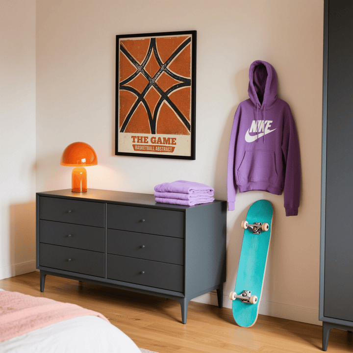 Print on a wall of basketball abstract print with orange black and cream colours above black sideboard in bedroom