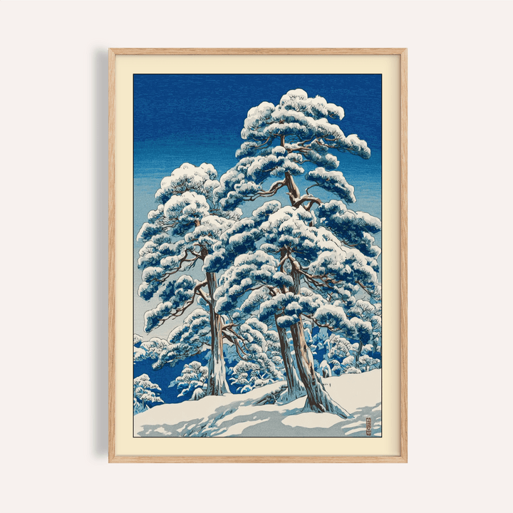 Framed close-up of Hasui Kawase Winter Landscape Print with snow-covered pine trees in Japanese woodblock style