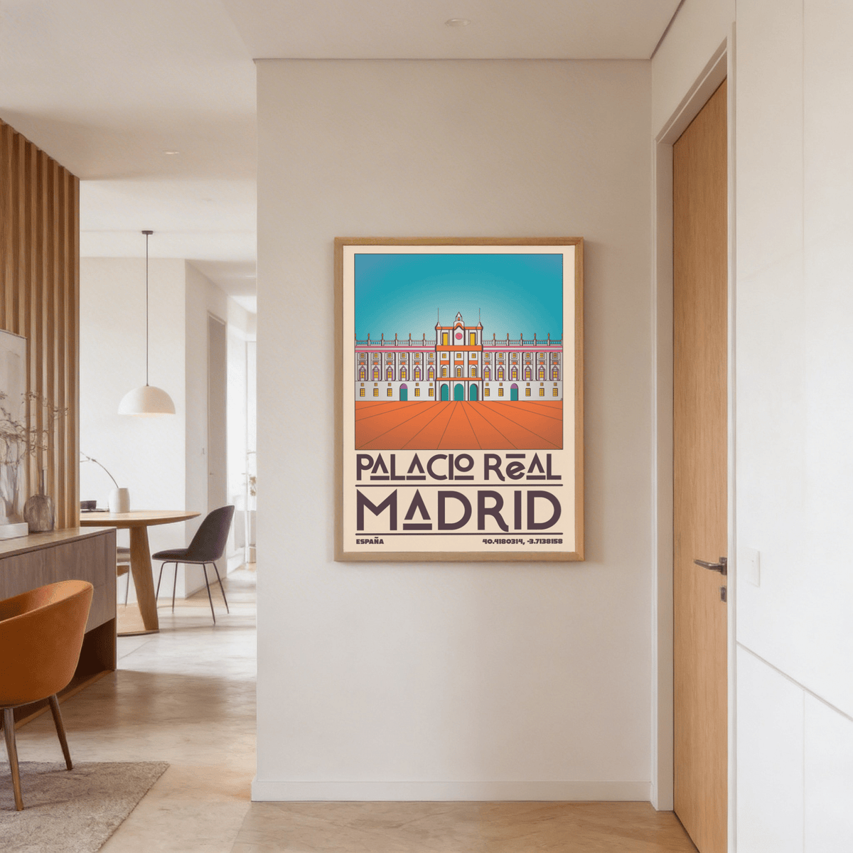 Madrid Royal Palace Poster hanging on a neutral wall near a wood door in a bright dining area