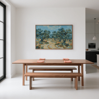 Olive Tree Landscape Print above a wooden dining table with benches in a bright room
