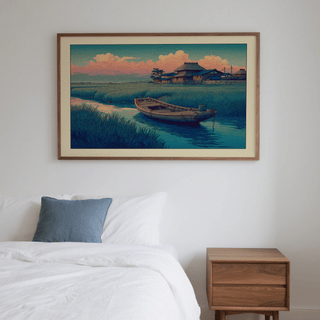 Hasui Kawase River Boat print leaning above a bed with a blue cushion and wooden bedside table