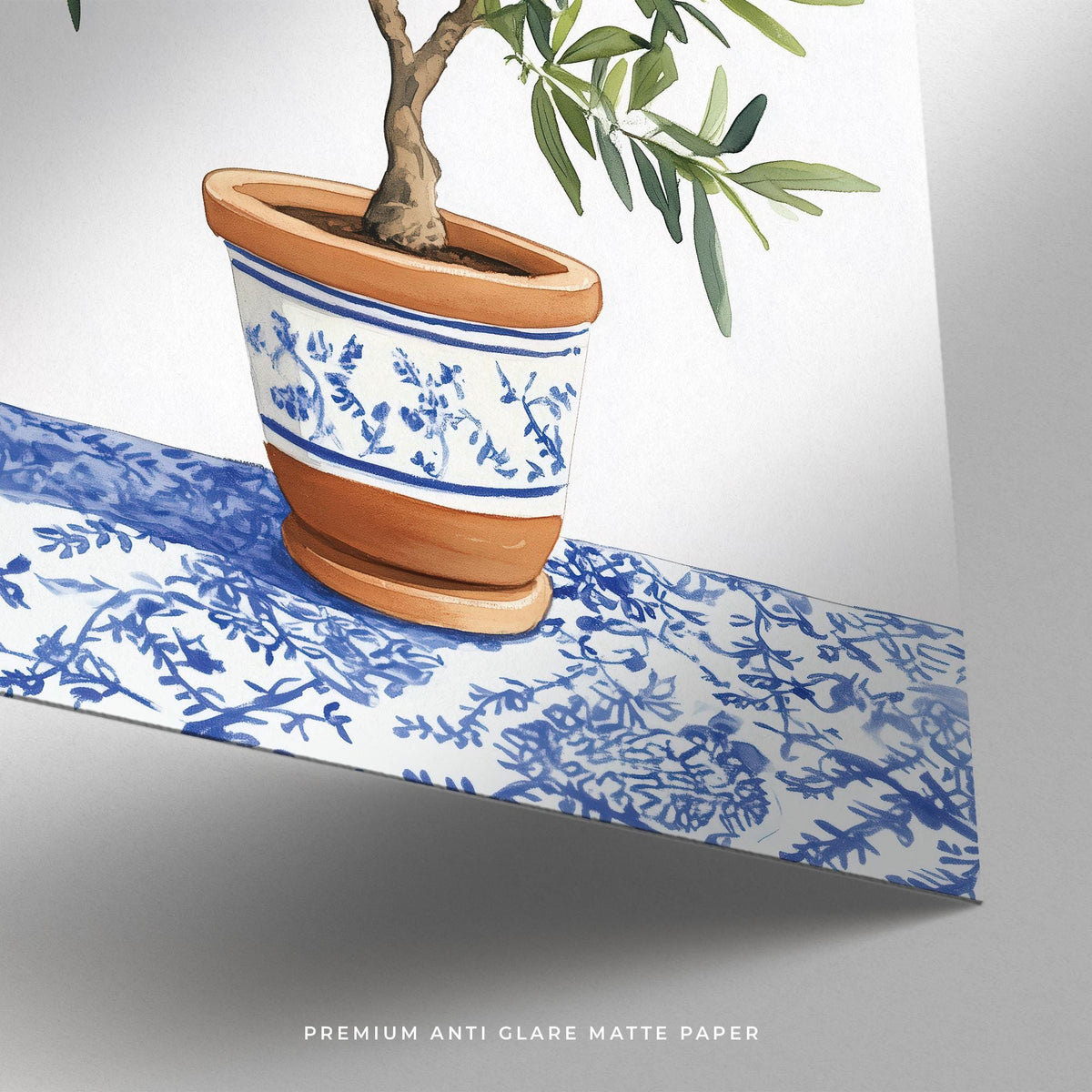 Detail close-up of olive tree art print showing terracotta pot with blue pattern and part of patterned surface