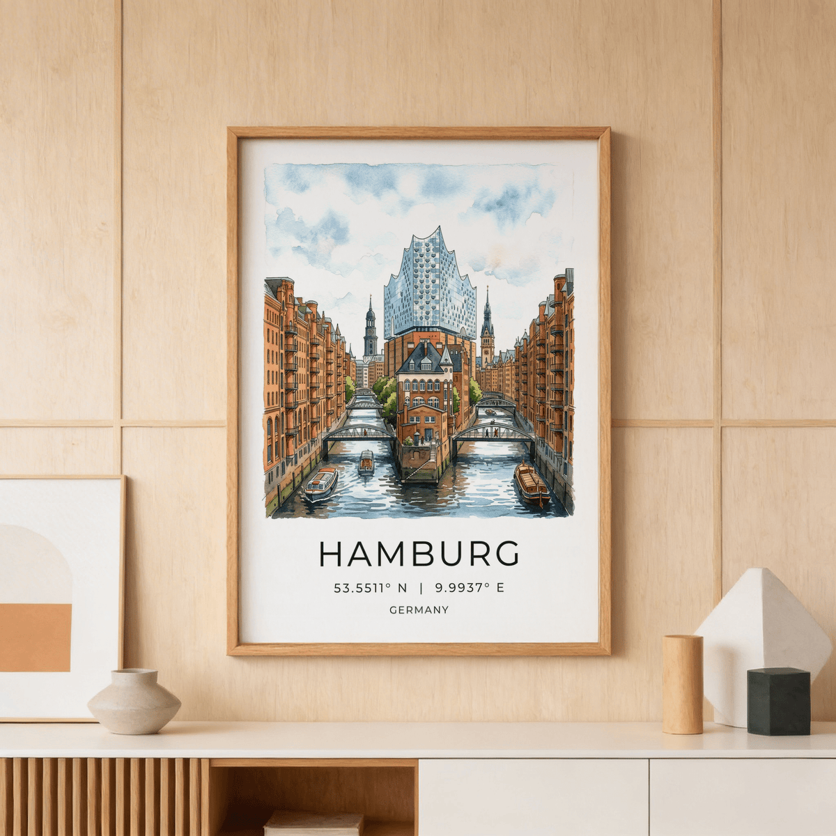 Framed Hamburg Cityscape Art Print of a canal with red brick buildings in a wood-panelled room above a cabinet