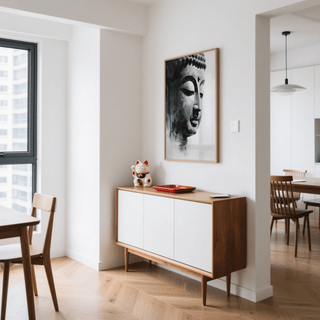 Buddha Art Print on wall in a dining room above a modern sideboard with a lucky cat ornament