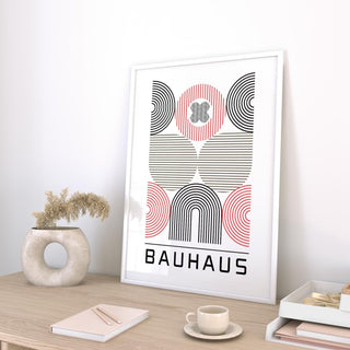 Framed Wall Art for Home Office with abstract geometric shapes and Bauhaus text on desk with vase