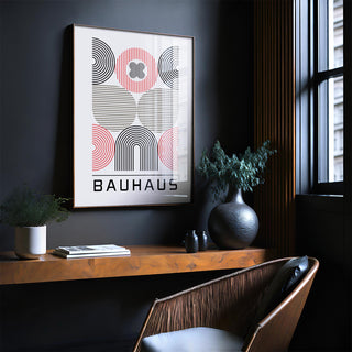 Wall art for home office with abstract geometric shapes in muted red black and beige above a wooden shelf