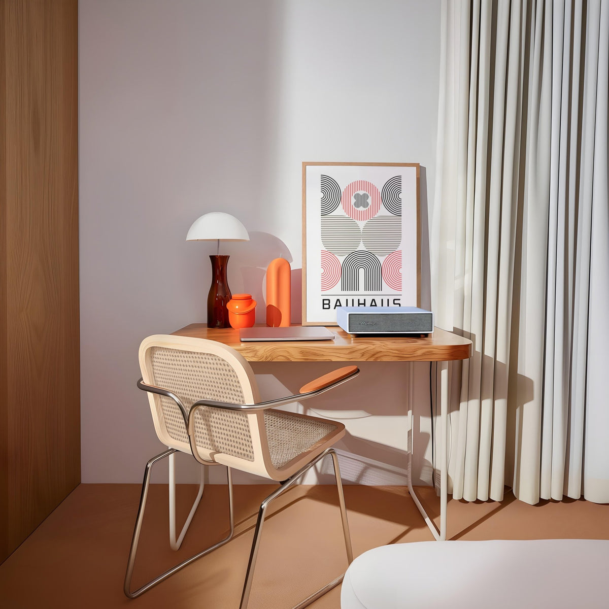 Wall Art for Home Office leaning on a wooden desk with a chair and lamp abstract geometric shapes in red black and beige