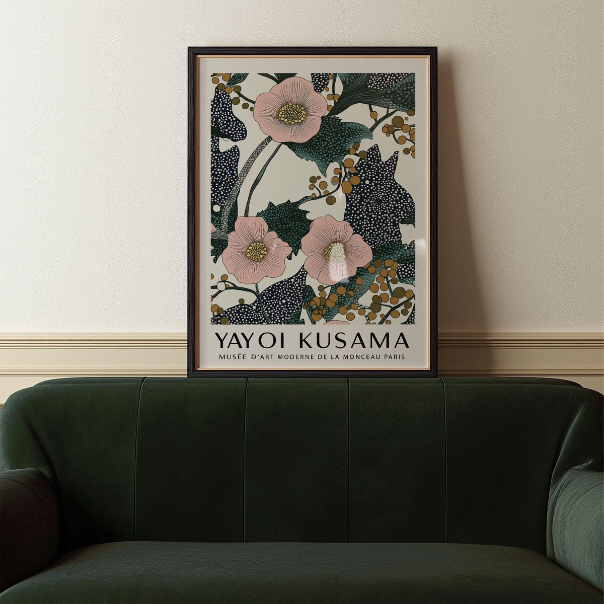 Framed Pink Wall Art for Bedroom showing pink flowers with berries above a dark green sofa