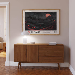 Moon Print hung above a wooden sideboard with a white lamp in a muted tone room