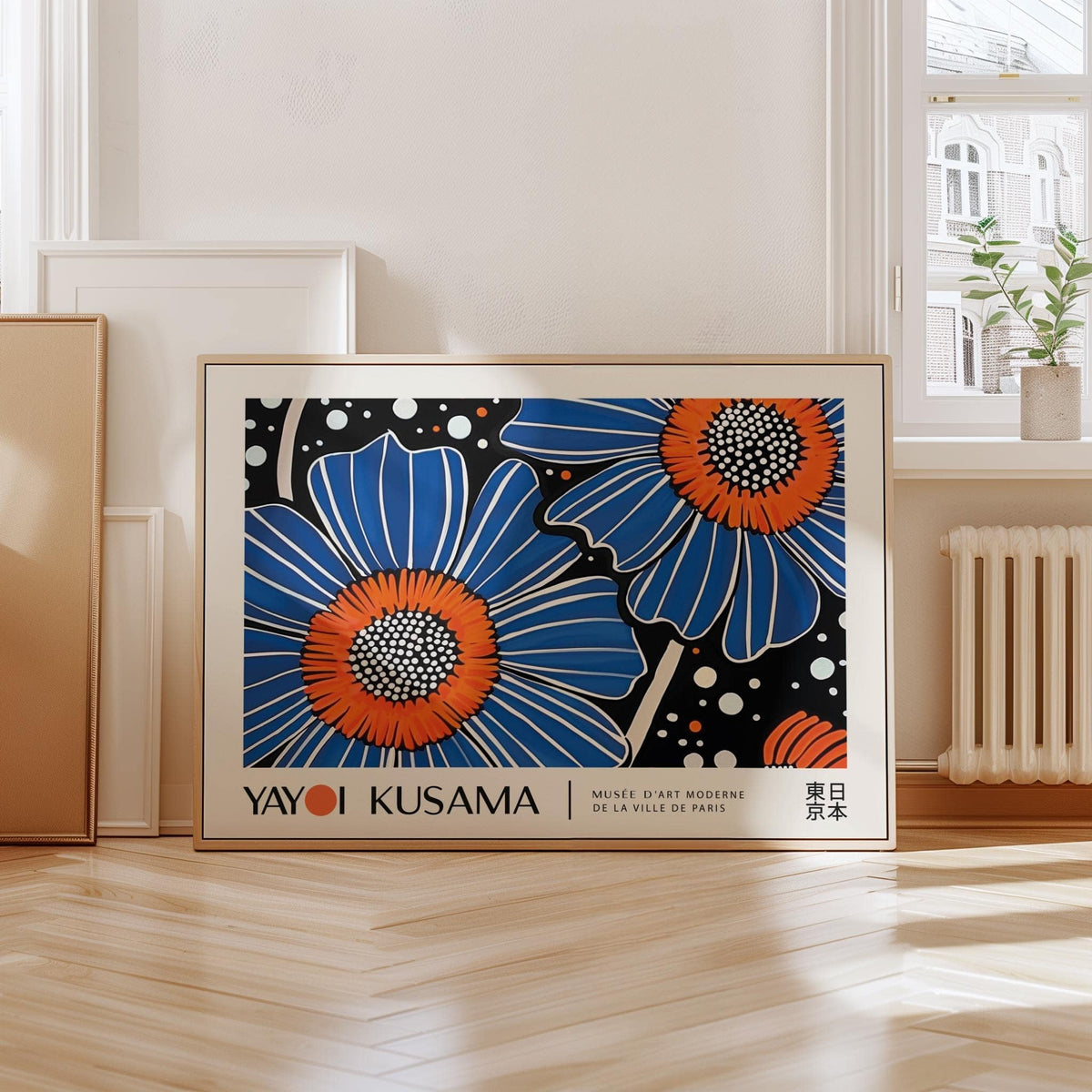 Unique Flower Art print leaning on floor by a window with a potted plant nearby