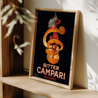 Framed Vintage Bitter Aperitif Poster with a woman and orange peel leaning on a wooden shelf