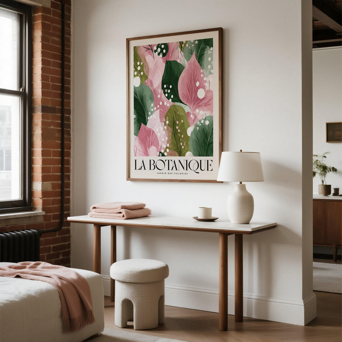 Floral Abstract Print on a wall with abstract leaves in pink and green above a white lamp