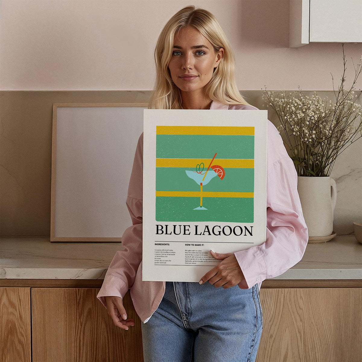 Kitchen wall pictures Blue Lagoon minimalist cocktail illustration held by woman in a kitchen