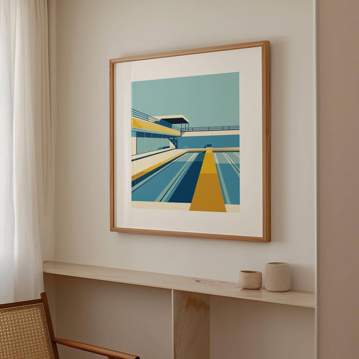 Pool print of an urban swimming pool in blue and yellow tones in a neutral room above a shelf