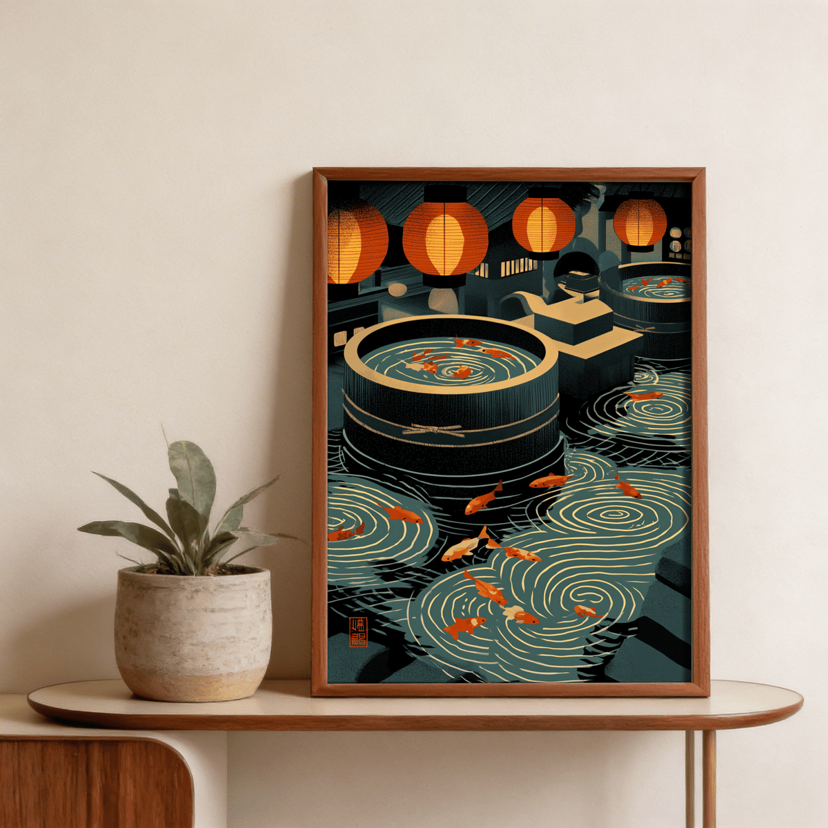 Framed Japanese Koi Art Print showing orange koi fish in water with blue and black tones on a wooden table with a plant