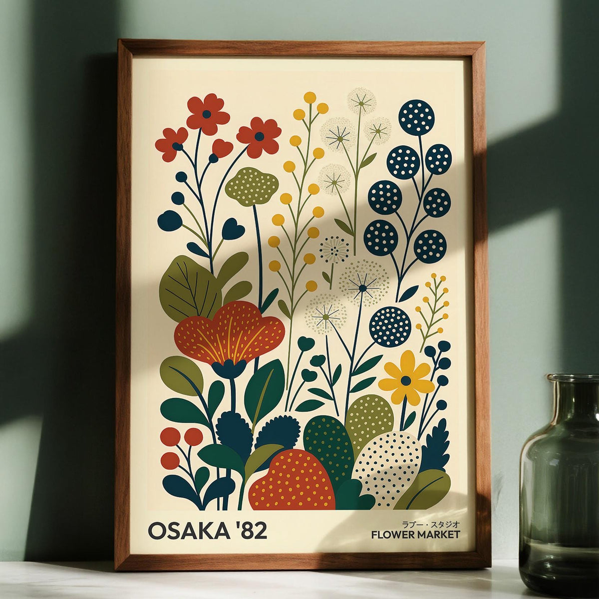 Nature Artwork framed print of minimalist stylized flowers in muted red yellow and blue with a glass vase nearby