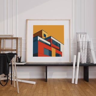 Art for the Office print of modernist building with red blue and yellow blocks on a bench by rolled blueprints