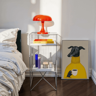 Illustrative Dog Wall Art print leaning against wall with colourful lamp and candles nearby