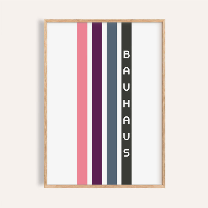Framed geometric art wall print with vertical stripes in pink, purple, blue, and black with text