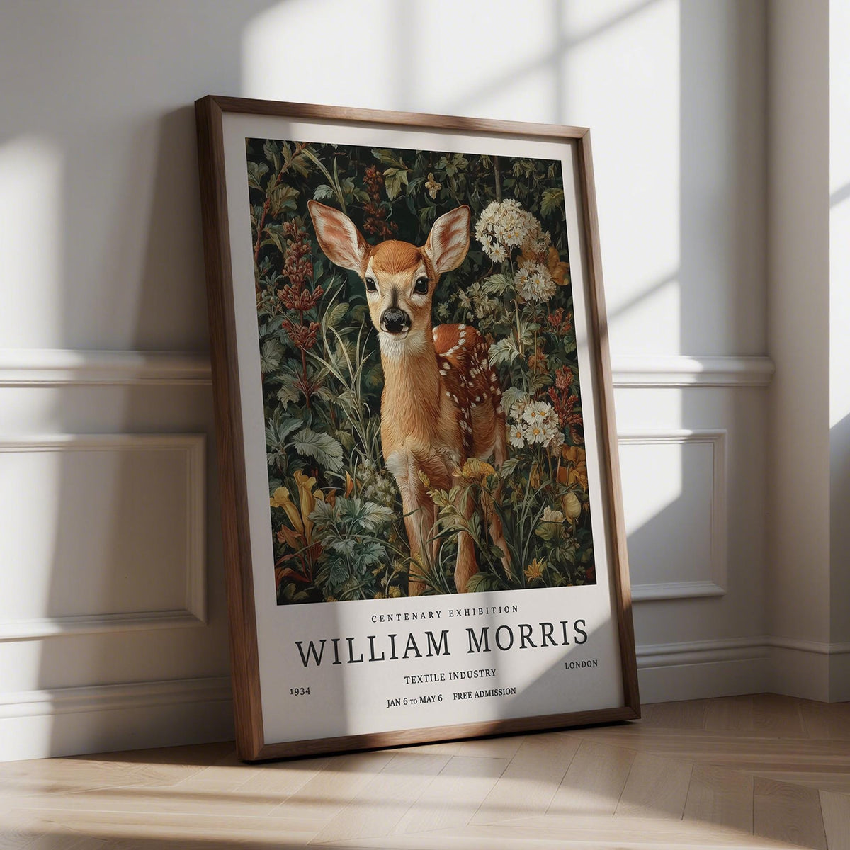 Print leaning on a floor of Woodland Fawn forest art print with brown frame and floral background