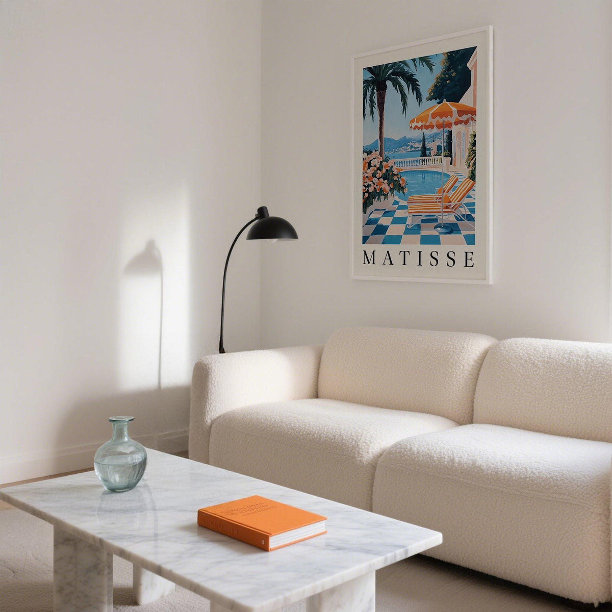 Amalfi Coast wall art print of a terrace with a pool in blue and orange in a living room above a white sofa