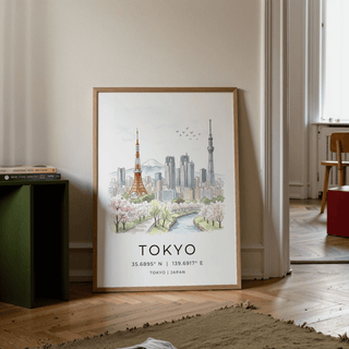 Print leaning on floor of Tokyo Skyline Art Print with cherry blossoms and watercolour cityscape