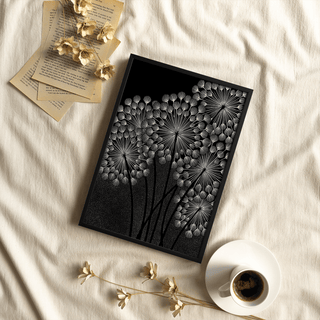 Framed Dandelions wall art in black and white with dried flowers beside it and a cup of coffee