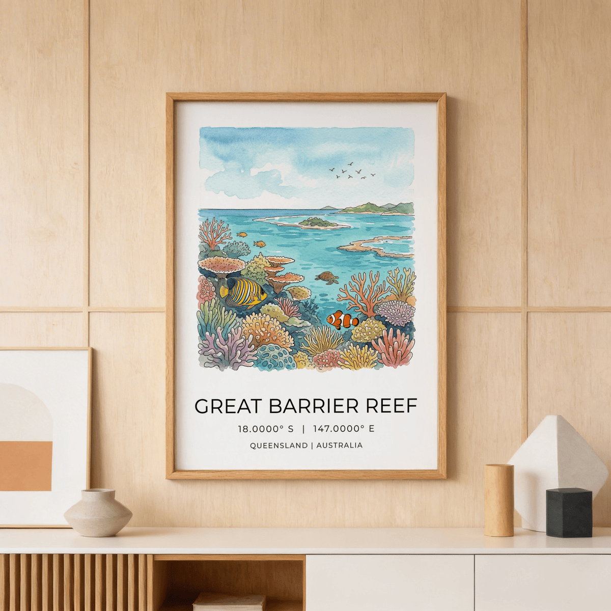 Great Barrier Reef art print of a colourful coral reef scene hanging above a sideboard with ceramics
