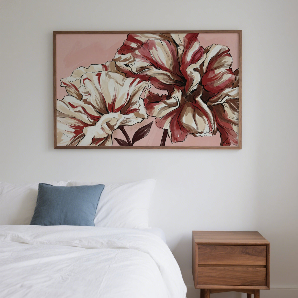 Pink Background Flower Print hanging above a bed with white bedding and a wooden bedside table