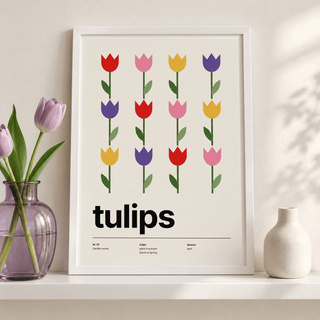 Rows of colourful tulips leaning on a picture ledge with books
